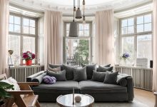 Фото - Круглая гостиная, роскошный настенный декор, стильная мебель: квартира в Стокгольме